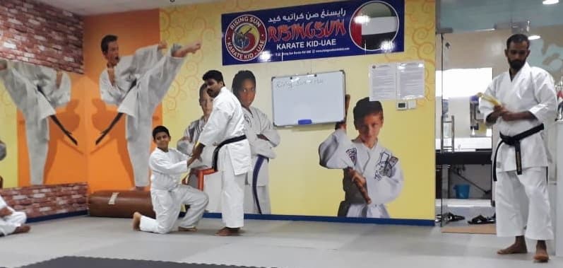 Being given karate belt